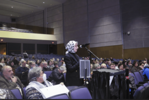 Tasneem Madani speaks in favor of the resolution. More than 120 people signed u to speak on the issue, Ann Arbor, Michigan January 17. – AP